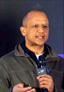 Jonathan Adjei speaking at a conference